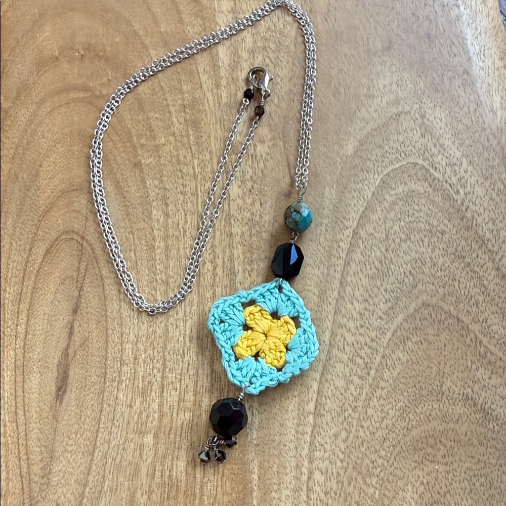Artisan Crochet Pendant Necklace with Yellow and Blue Accents